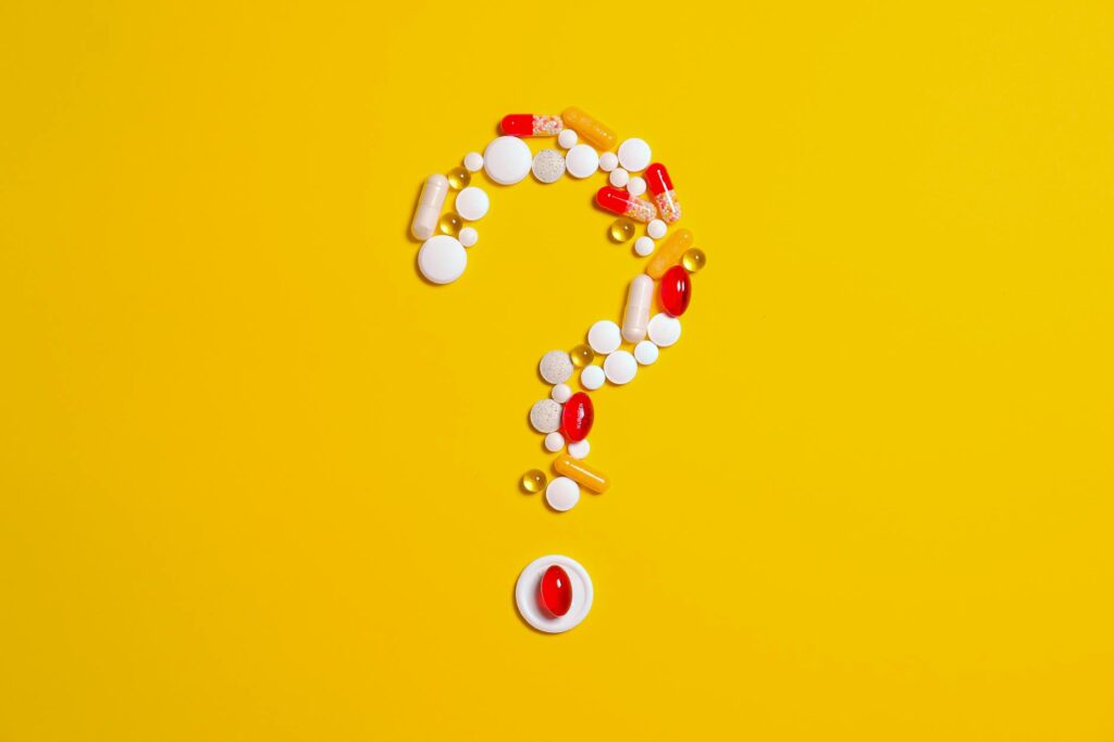 medication pills isolated on yellow background